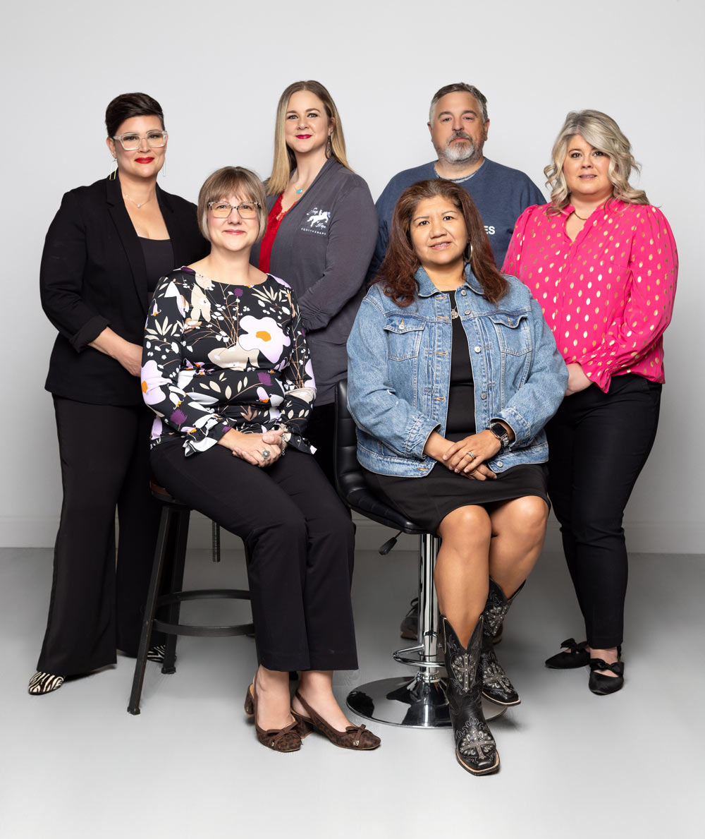 local-life-feat-1224 Top row, left to right: Shandy Stogsdill, Allison Gross, Garrett Roper, Summer Garcia<br />
Front: Elizabeth Becker, Lisa Boultinghouse